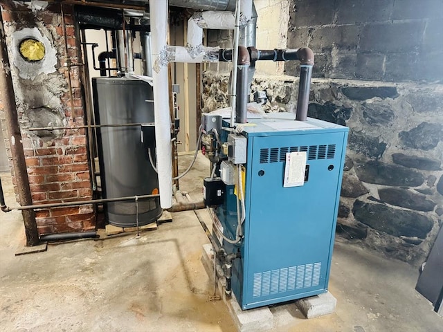 utility room with a heating unit and water heater