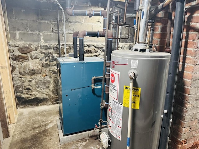 utility room featuring gas water heater