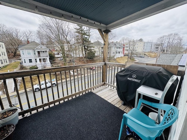 balcony with grilling area and a residential view