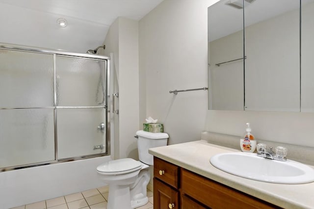 full bathroom featuring tile patterned flooring, vanity, bath / shower combo with glass door, and toilet