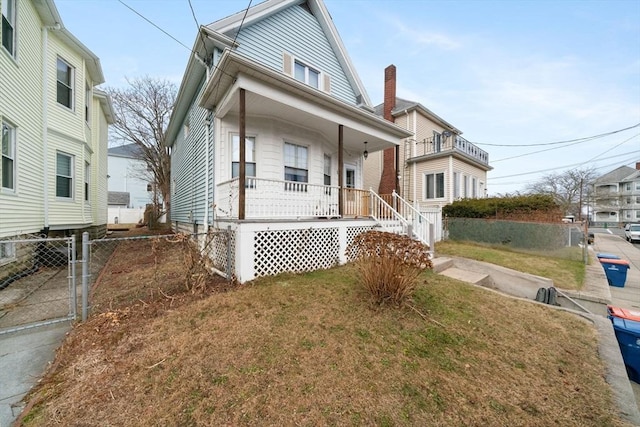 bungalow-style house with a porch and a front yard