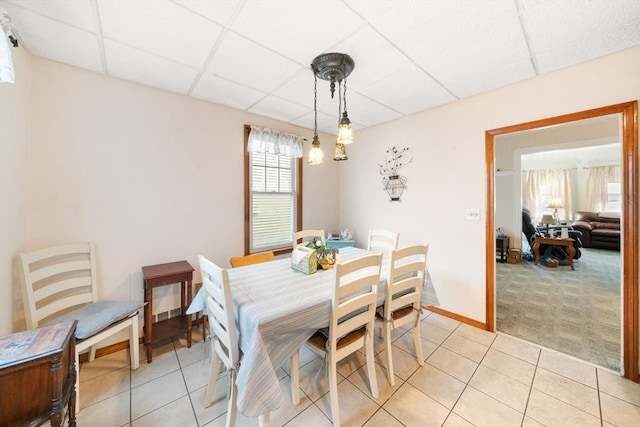 dining area with a drop ceiling