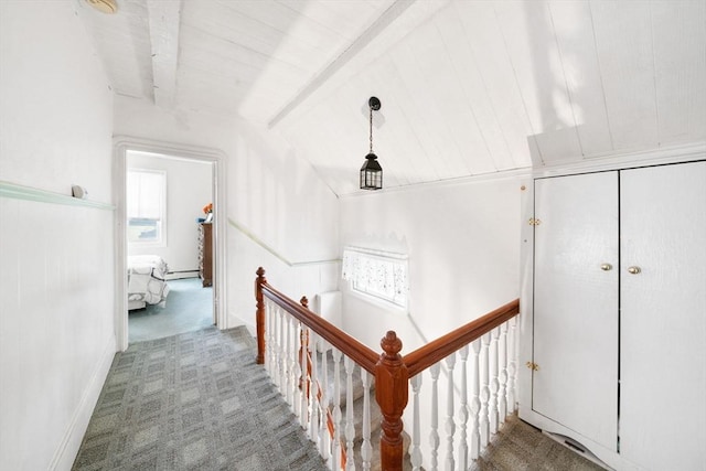 hallway with lofted ceiling with beams, carpet floors, and wooden ceiling