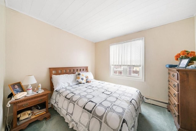 bedroom featuring dark carpet and a baseboard heating unit