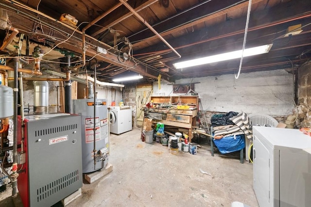 basement featuring washer and dryer and water heater