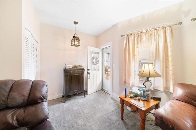 view of carpeted foyer entrance