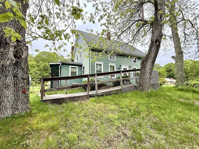 527 Collins Corner Rd, Dartmouth, MA 02747 - rear view of property featuring a chimney and a wooden deck