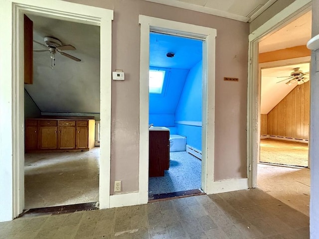 527 Collins Corner Rd, Dartmouth, MA 02747 - corridor with lofted ceiling, baseboard heating, and tile patterned floors