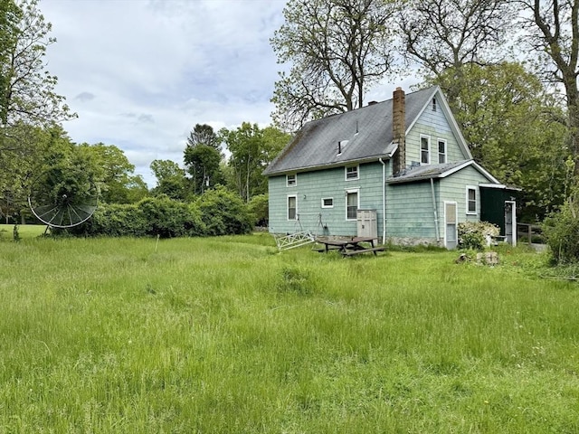 527 Collins Corner Rd, Dartmouth, MA 02747 - rear view of property featuring a chimney and a shingled roof