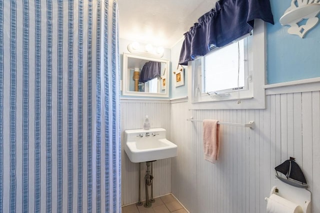 bathroom with tile patterned flooring