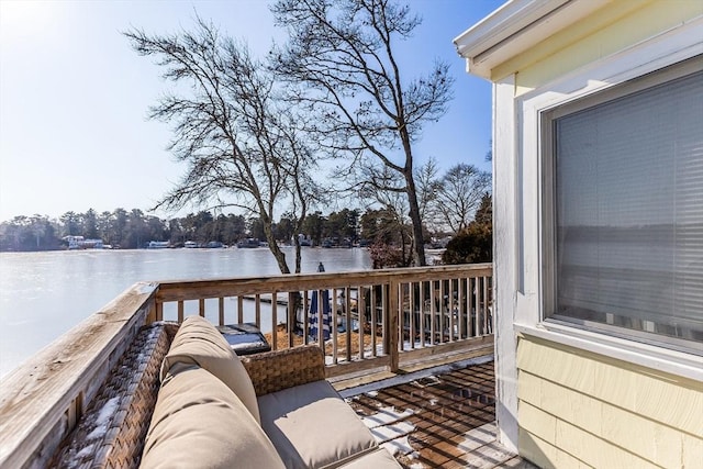 wooden deck featuring a water view