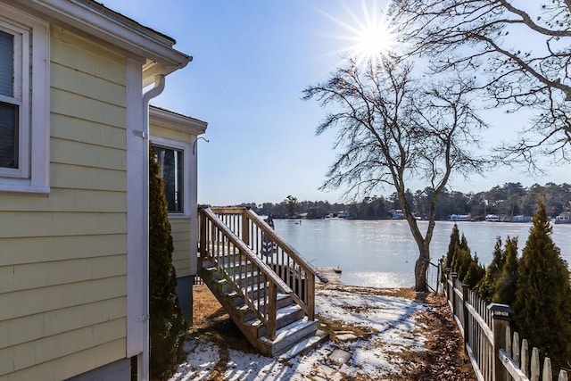 wooden terrace featuring a water view