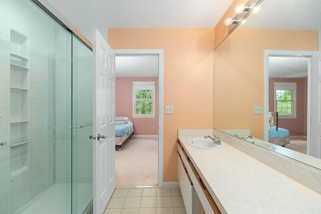 19 Garden St Unit 107, Danvers, MA 01923 - full bath featuring ensuite bathroom, vanity, a shower stall, and tile patterned flooring