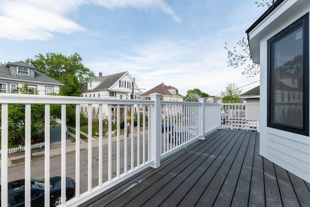 wooden deck featuring a residential view