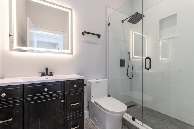 full bath with a stall shower, toilet, and vanity