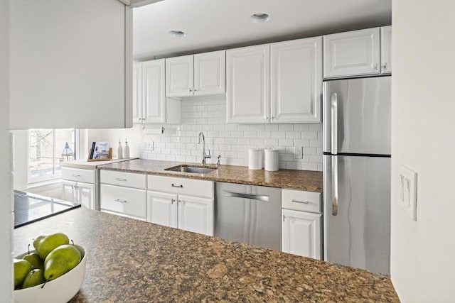 kitchen with white cabinets, sink, and stainless steel appliances