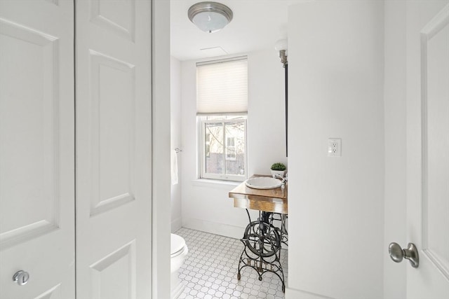 bathroom featuring toilet and sink