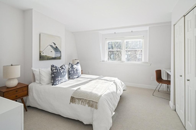 carpeted bedroom featuring a closet