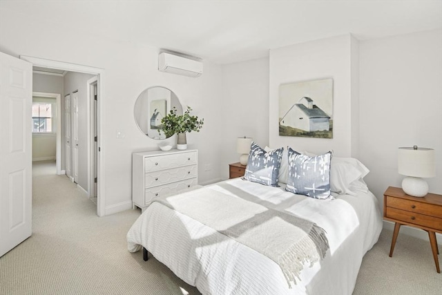 carpeted bedroom with an AC wall unit