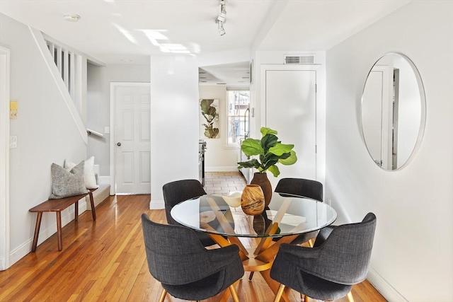 dining area with light wood-type flooring