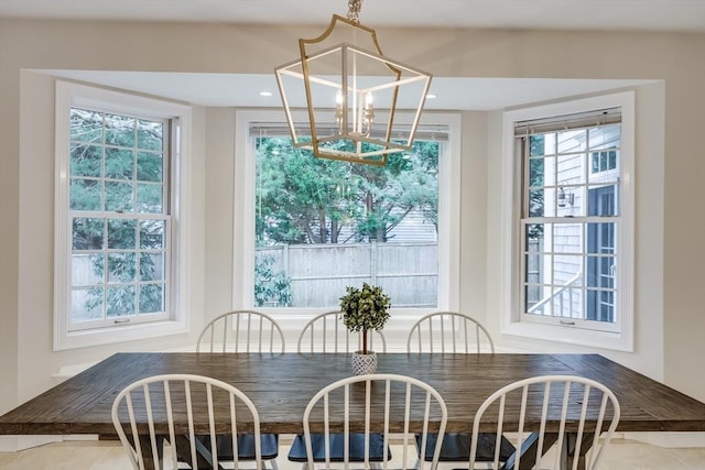 dining room with a notable chandelier