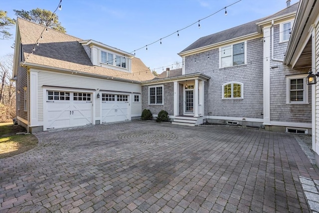 view of front of property with a garage