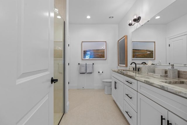 full bathroom featuring recessed lighting, a shower with door, a sink, and double vanity