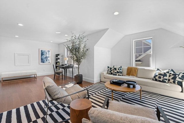 living area featuring lofted ceiling, baseboards, wood finished floors, and recessed lighting