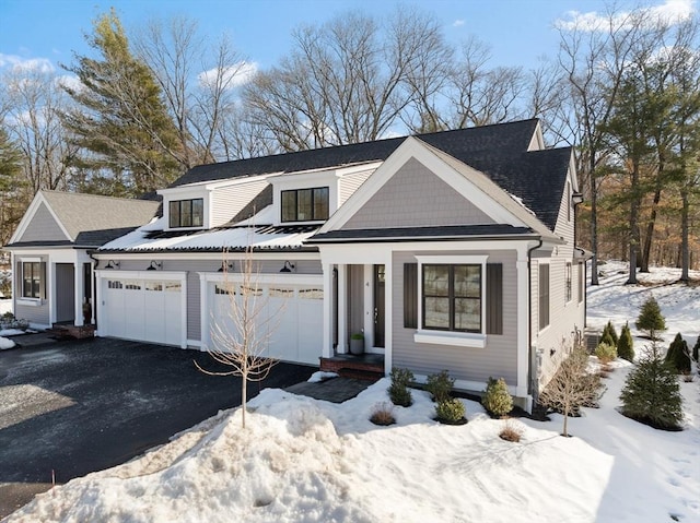 view of front facade featuring driveway and an attached garage