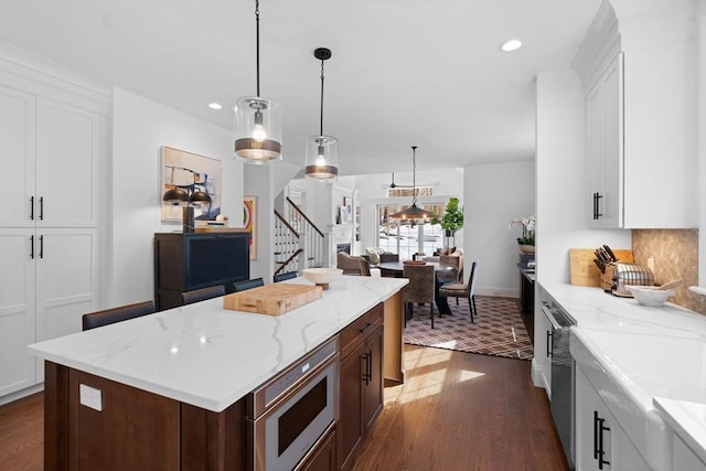 kitchen featuring white cabinetry, built in microwave, dark wood-style flooring, and recessed lighting