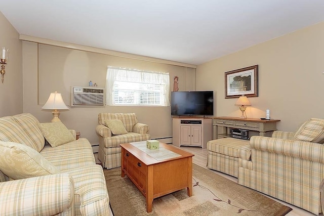 living area featuring a baseboard heating unit and an AC wall unit