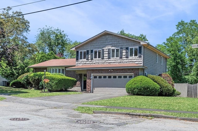 24 Gerald Rd, Marblehead, MA 01945 - tri-level home with asphalt driveway, an attached garage, and brick siding