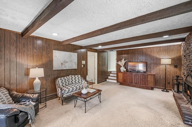 24 Gerald Rd, Marblehead, MA 01945 - living area featuring a textured ceiling, beam ceiling, wooden walls, carpet flooring, and stairs