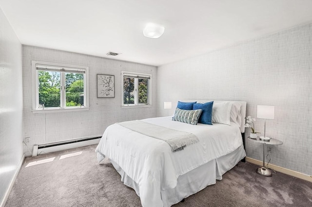 24 Gerald Rd, Marblehead, MA 01945 - carpeted bedroom featuring a baseboard heating unit and multiple windows