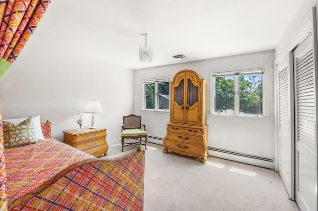 24 Gerald Rd, Marblehead, MA 01945 - carpeted bedroom with a baseboard heating unit, a closet, and a chandelier