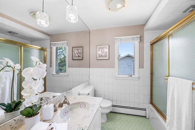 24 Gerald Rd, Marblehead, MA 01945 - bathroom featuring a baseboard heating unit, tile walls, healthy amount of natural light, tile patterned floors, and vanity