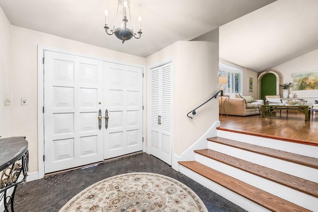 24 Gerald Rd, Marblehead, MA 01945 - entryway with arched walkways, a chandelier, and vaulted ceiling