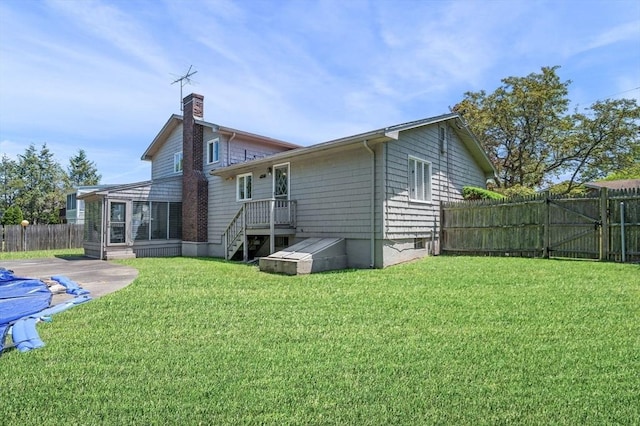 24 Gerald Rd, Marblehead, MA 01945 - back of property featuring a chimney and a gate