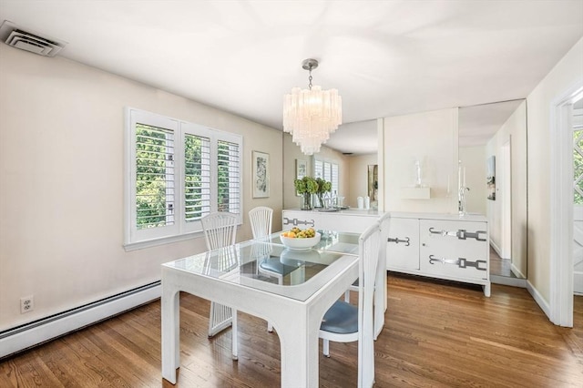 24 Gerald Rd, Marblehead, MA 01945 - dining area featuring baseboard heating, a chandelier, and wood finished floors