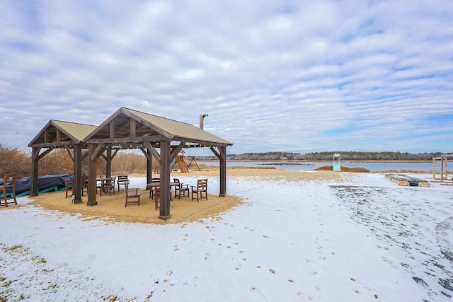 view of property's community featuring a gazebo and a water view