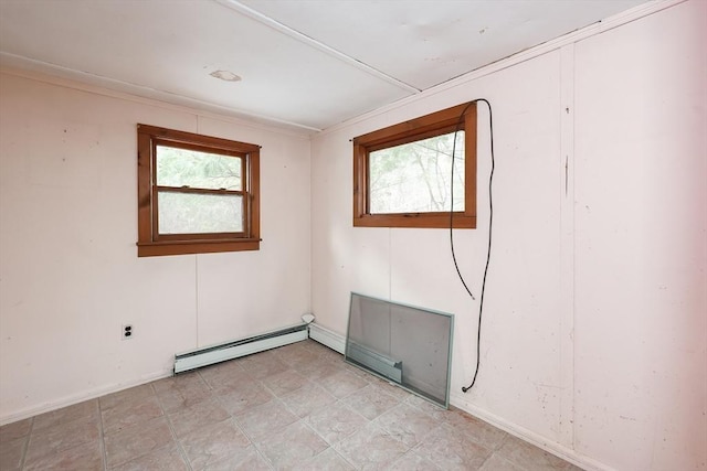 unfurnished room featuring crown molding and a baseboard radiator