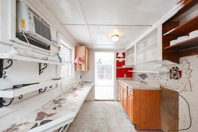 kitchen featuring sink and a wall mounted air conditioner