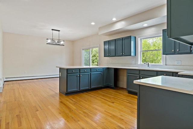20 Miller St, Rehoboth, MA 02769 - kitchen featuring a peninsula, light wood finished floors, light countertops, decorative light fixtures, and recessed lighting