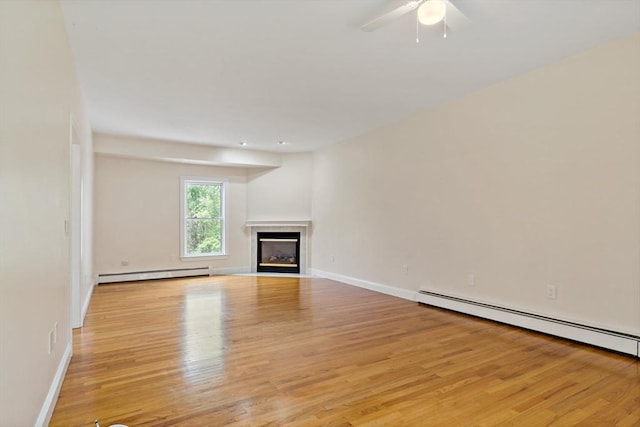 20 Miller St, Rehoboth, MA 02769 - unfurnished living room featuring a baseboard heating unit, light wood-style floors, a premium fireplace, and ceiling fan
