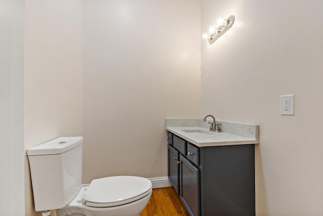 20 Miller St, Rehoboth, MA 02769 - bathroom with toilet, vanity, wood finished floors, and baseboards