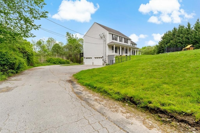 20 Miller St, Rehoboth, MA 02769 - view of home's exterior with a garage, driveway, a yard, and a porch