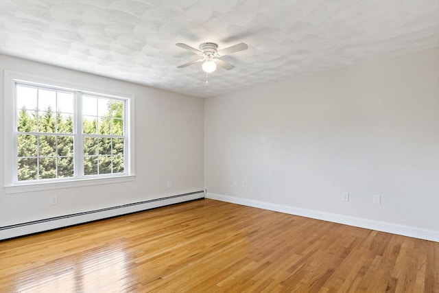 20 Miller St, Rehoboth, MA 02769 - empty room featuring baseboard heating, ceiling fan, baseboards, and wood finished floors