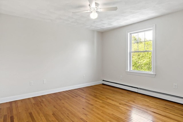 20 Miller St, Rehoboth, MA 02769 - spare room featuring baseboard heating, a ceiling fan, light wood-style flooring, and baseboards