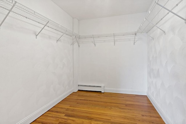 20 Miller St, Rehoboth, MA 02769 - walk in closet featuring baseboard heating and wood finished floors