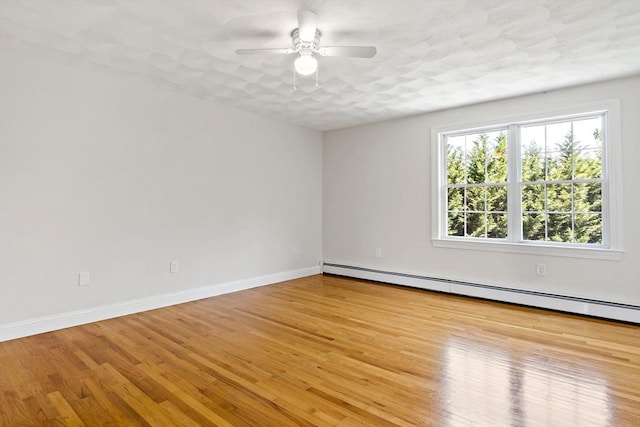 20 Miller St, Rehoboth, MA 02769 - spare room featuring baseboard heating, wood finished floors, a ceiling fan, and baseboards